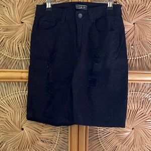 Black ripped Bermuda shorts